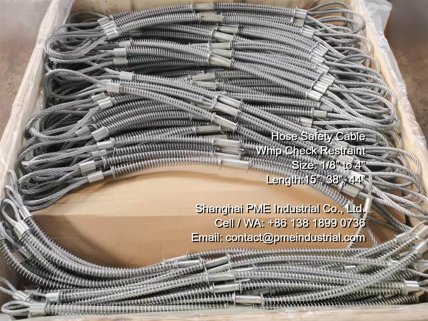 Industrial hose safety cable installed on a high-pressure hose-to-hose connection.