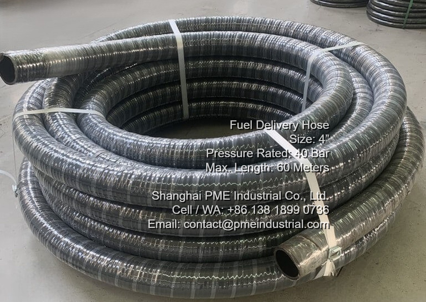 Coiled reels of PME 4-inch 40 bar heavy duty NBR rubber hose in factory ready for shipment